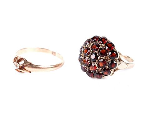 A diamond ring, in 14ct gold mount, size O, 1.7g gross; and a garnet cluster ring, in 9ct gold mount and shank, size K, 3.4g 