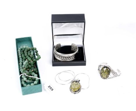 A selection of silver and costume jewellery, including: a jadeite bead necklace, with silver clasp, approximately 63cms long;