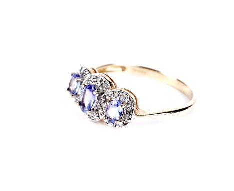 A tanzanite and diamond triple cluster ring, in 9ct yellow gold mount and shank, ring size P, 2.0g gross.
