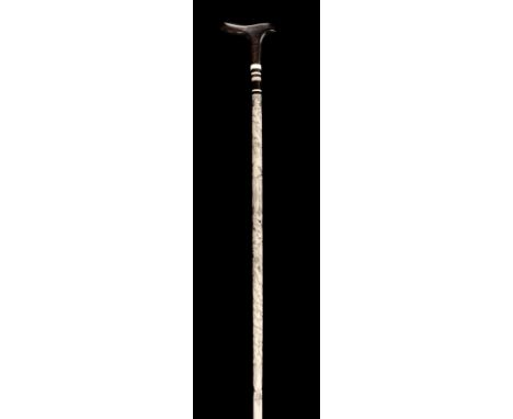 * Whalebone Stick. A Victorian whalebone ladies stick, the whalebone with later scrimshaw floral decoration, with rosewood ha