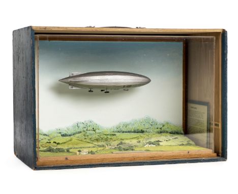 * R.100 Airship. A well-made diorama of the British airship, circa 1925, modelled over a hilly country landscape, housed in a