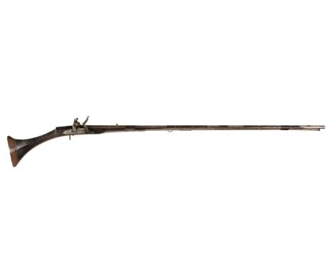 * Musket. A 19th Century Indian Flintlock Musket, the 128cm long circular tapered barrel engraved foliate scrolls, with engra