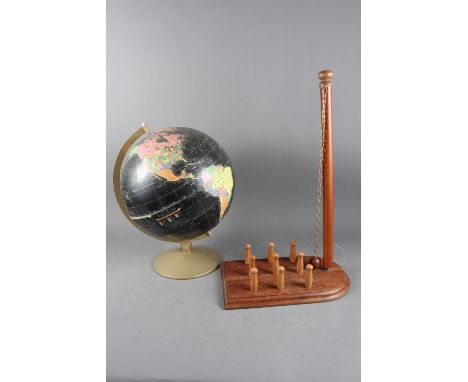 A terrestrial globe, in original box, and a bar skittles set 