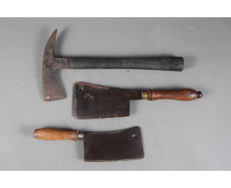 A meat cleaver knife, stamped “Dankre Gussstahl” on the blade, another meat cleaver and a WWII crash axe 