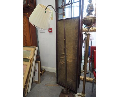 A brass standard lamp of Edwardian design, 58" high, a hardwood table lamp and shade, 30" high, a silvered table lamp and sha