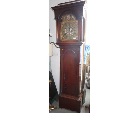 A 19th century oak long case clock with arch top, painted moon phase dial and eight-day striking movement by Foster, Wakefiel