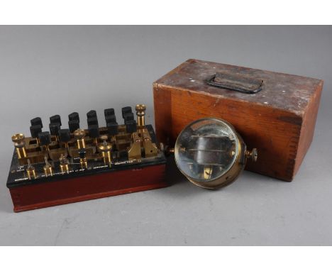 A Reid Bros, London brass cased horizontal galvanometer, 4” dia, and a Gambrell Bros galvanometer/resistance box 