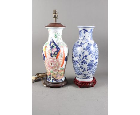 A Chinese baluster vase with landscape decoration (now converted to a table lamp), on turned hardwood stand, and a similar Ch