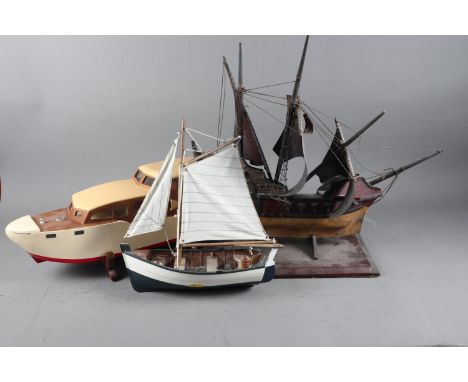 A painted wooden scale model of a galleon, 17” high (damaged), a scale model of a sailing boat and an electric boat named “Cl
