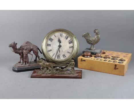 A brass bulkhead clock with white painted dial and Roman numerals with subsidiary seconds dial, 9” dia, a relief brass plaque