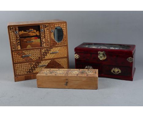 A Japanese marquetry jewellery cabinet, fitted sliding doors, mirror and drawers, 10 1/2” wide x 10 1/2” high, a similar Japa