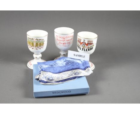 A set of twelve Royal Doulton bone China “Twelve Days of Christmas” goblets and a Wedgwood silk scarf, boxed 