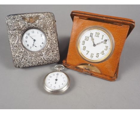 A silver mounted pocket watch case, a travelling clock and a chrome cased pocket watch 