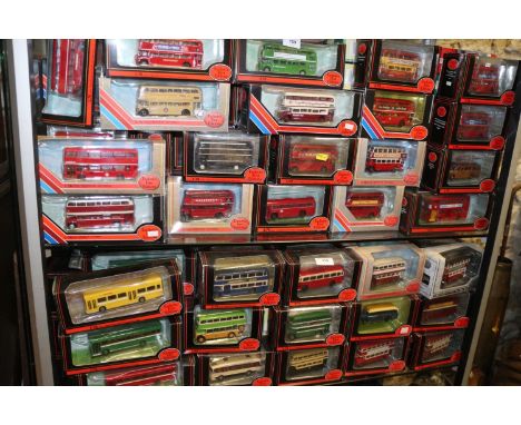 Nineteen die-cast model bus gift sets, including London Transport Museum bus sets, and approximately 140 Exclusive First Edit