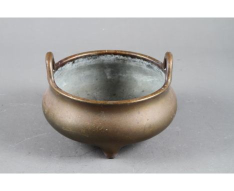A Chinese bronze censer on three legs, seal mark, 6” dia 1474gCondition:Surface scratches, no visible issues. 