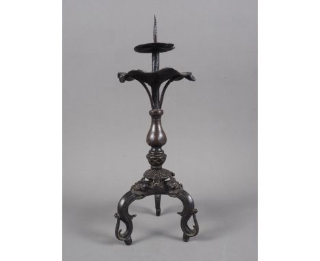 A Chinese bronze pricket candlestick with dragon and lotus leaf design, 11 3/4” highCondition:One of the three support stems 