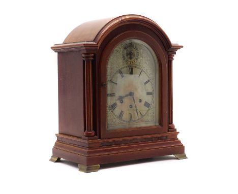 An oak mantle clock the silvered dial, flanked by two columns, the movement stamped, 'Gustarb Becker'40cm high32cm wideCondit