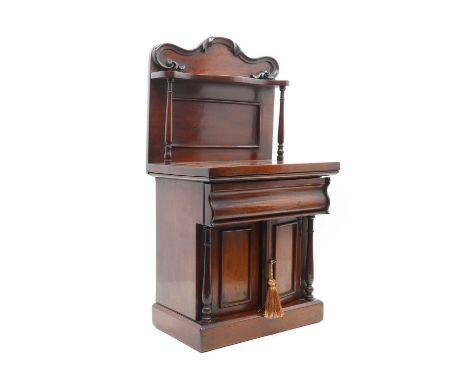 A miniature mahogany chiffonier c 19th century, the carved raised back with a single shelf above turned supports, a single fr