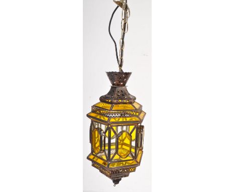 A vintage 20th century Arts &amp; Crafts style coloured glass &amp; metal hanging porch lantern light. The lantern having sid