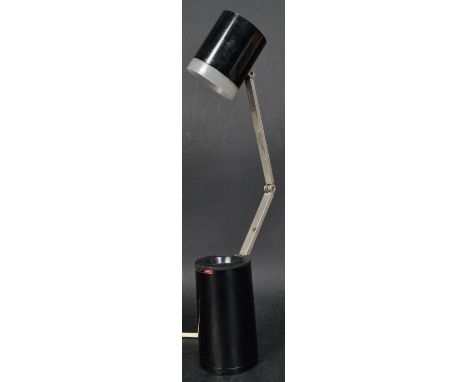 A vintage retro mid 20th century Japanese made Lloyds table lamp. The lamp being of cylindrical form and opening to reveal ar