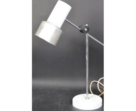 A vintage retro mid 20th century adjustable desk lamp. The lamp having chrome and white cylindrical shade over a circular whi