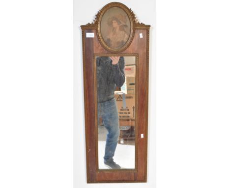 An early 20th Century wall hanging mirror. With gilt and rosewood border, portrait decoration to top with hanging wire to ver