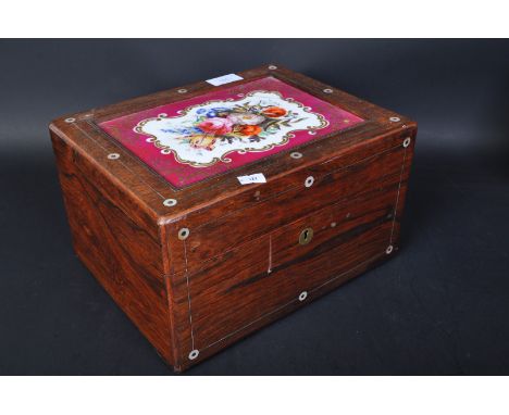 A 19th century rosewood and leather ladies vanity box case. Having a ceramic hand painted decorated top with gilt and floral 