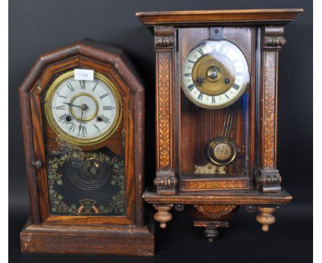 An early 20th century inlaid marquetry wall hanging clock. The clock having central gilt metal gadrooning with black enamelle