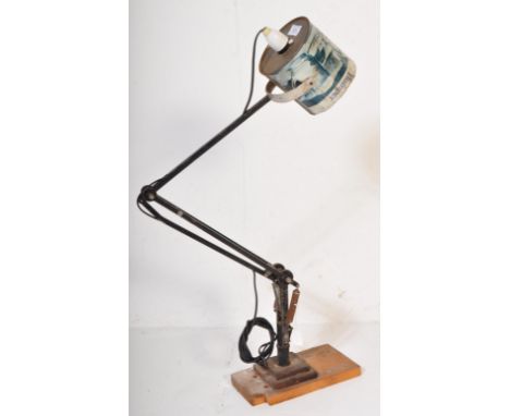 A retro vintage 20th Century Anglepoise type lamp light. Having a recycled tin shade, with ebonised bar supports, spring load