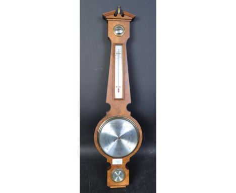 A 20th century Comitti of London mahogany cased aneroid banjo barometer with silvered dial to centre and thermometer atop hav