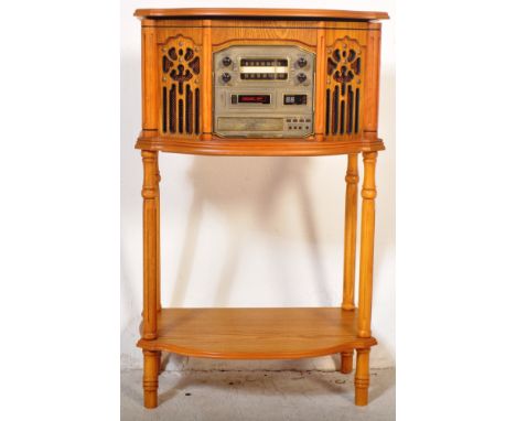 A vintage 20th century pine Canterbury cassette and CD player phonograph with radio /&nbsp; stereogram within a pine case wit