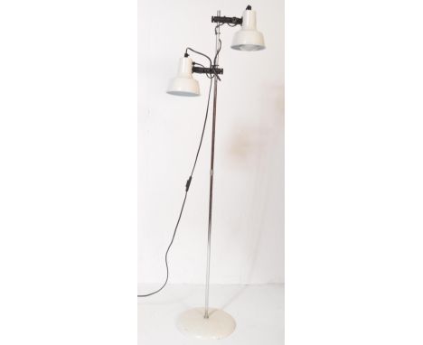 A vintage retro mid 20th century double head floor standing standard lamp having whiter conical shades over tubular shaft upo