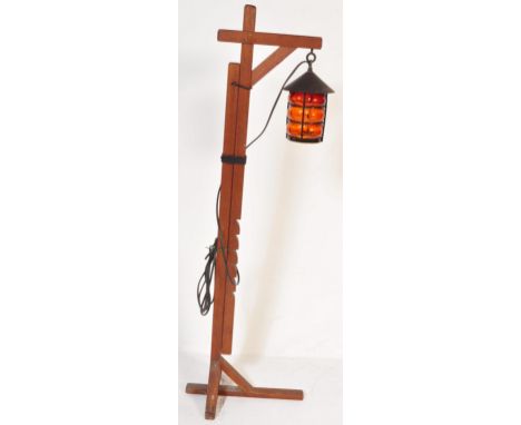A contemporary Oriental style wooden &amp; metal porch lantern with stand. The hanging lantern having a conical top over an o