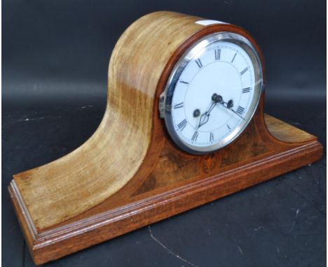 An Edwardian early 20th century inlaid Napoleon hat shaped mantel clock. The oak mantle clock having an 8 day chime with Roma
