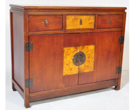 A vintage style Chinese eastern Asian style sideboard credenza cabinet, Of rectangular form with twin cabinet to bottom with 