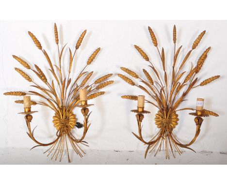 A pair of mid 20th century circa 1950s gilt metal wall shaped lights. Each lamp being shaped in the form of a bouquet of ears