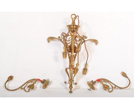 A 19th Century Art Nouveau brass hanging ceiling light. Having a tapering body with heart decorations, curved ball finials wi