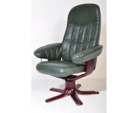 A retro vintage 20th Century swivel reclining desk office armchair. Having green leather back, armrests and cushioned seat on