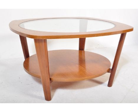 Manner of G-Plan Furniture. A Mid-century teak wood Astro style coffee occasional table with glass centre, teak wood surround