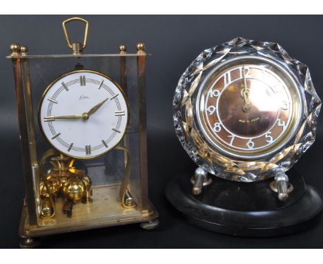 Two vintage retro mid 20th century mantel clocks comprising of a USSR Majak mantel clock having faceted glass case on chrome 
