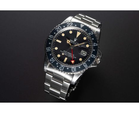 A RARE GENTLEMAN'S STAINLESS STEEL ROLEX OYSTER PERPETUAL GMT MASTER BRACELET WATCHCIRCA 1973, REF. 1675 WITH LATER MK4 DIAL 