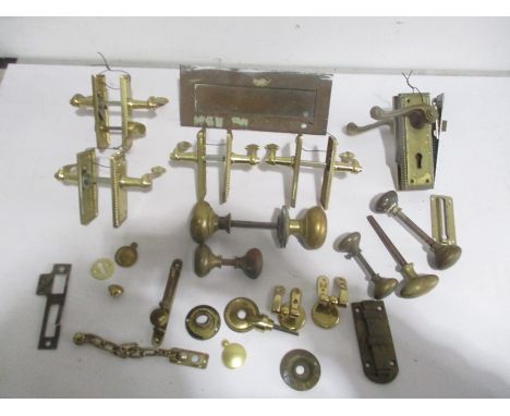 A collection of brass door furniture