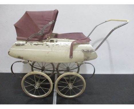 A vintage dolls sprung pram