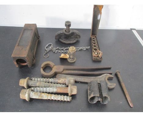 A collection of railway related items including a brass cylinder pressure release valve, carriage seat spikes tools etc.