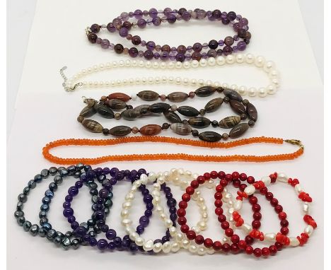A collection of modern necklaces etc including pearls, 'ghost amethyst', fire opal, fossilised wood etc