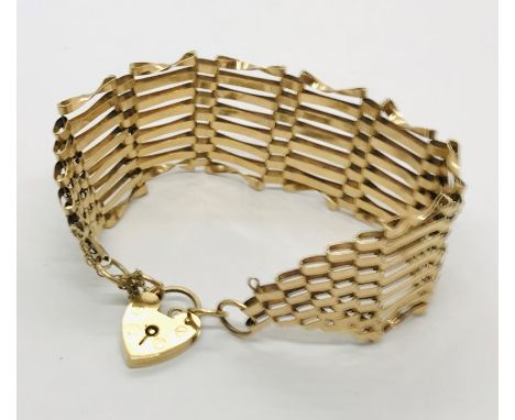 A 9ct gold gate bracelet with padlock. Weight 15.6g