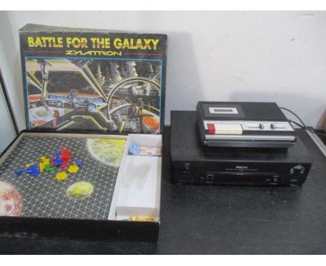 A board game "Battle for the Galaxy- Zylattron" along with a cassette recorder and a  Philips VCR