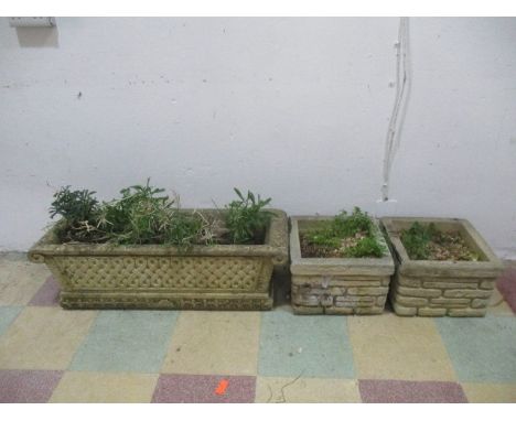  A concrete ornate, rectangular planter along with two others