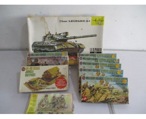 A Hellar 1:35 boxed Leopard A2 model tank, an Airfix boxed HO-OO scale jungle outpost. A boxed Hellar 1:35 French fire unit b