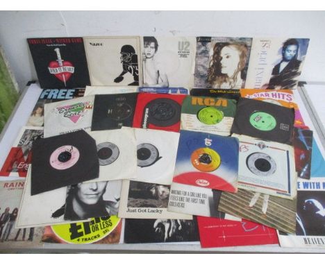 A collection of 7" vinyl single records including David Bowie, Free,  Rainbow, The Rolling Stones, Black Sabbath etc